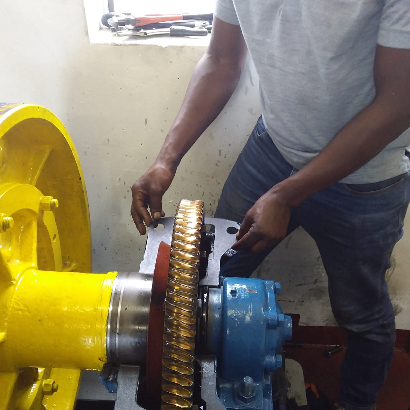 Technician servicing elevator motor